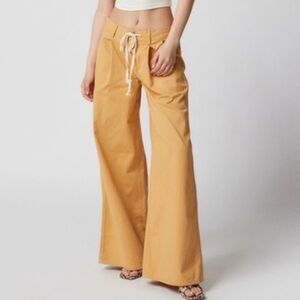Urban Outfitters Isabella wide-leg pleated trousers in a mustard/tan color